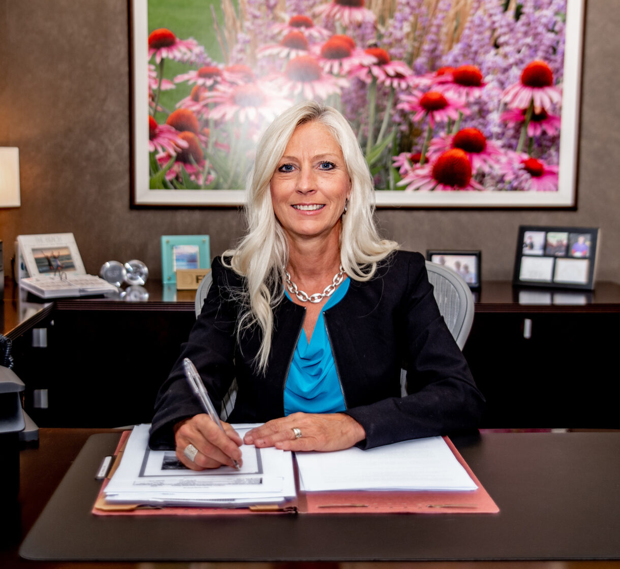 Leah Kays sitting at her desk in her office at the Poplar Grove location